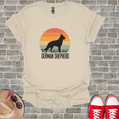 T-shirt with a black German Shepherd silhouette against a sunset.