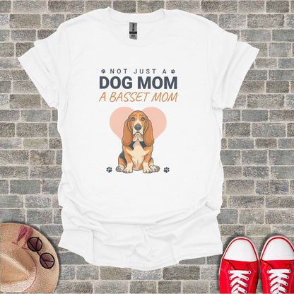 White t-shirt graphic: "Not Just a Dog Mom, a Basset Mom" with Basset Hound.