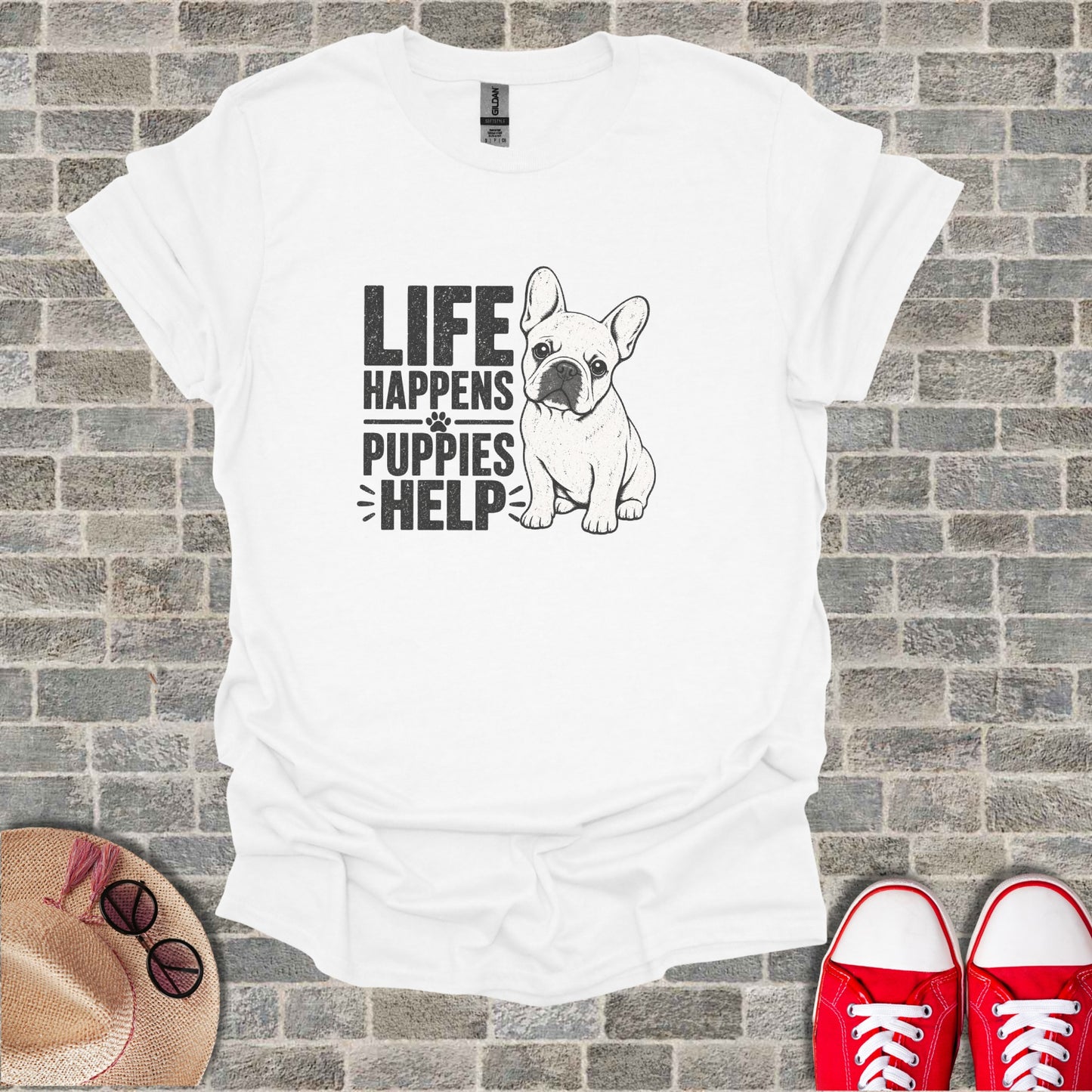 White t-shirt with "LIFE HAPPENS PUPPIES HELP" text and a French Bulldog illustration.