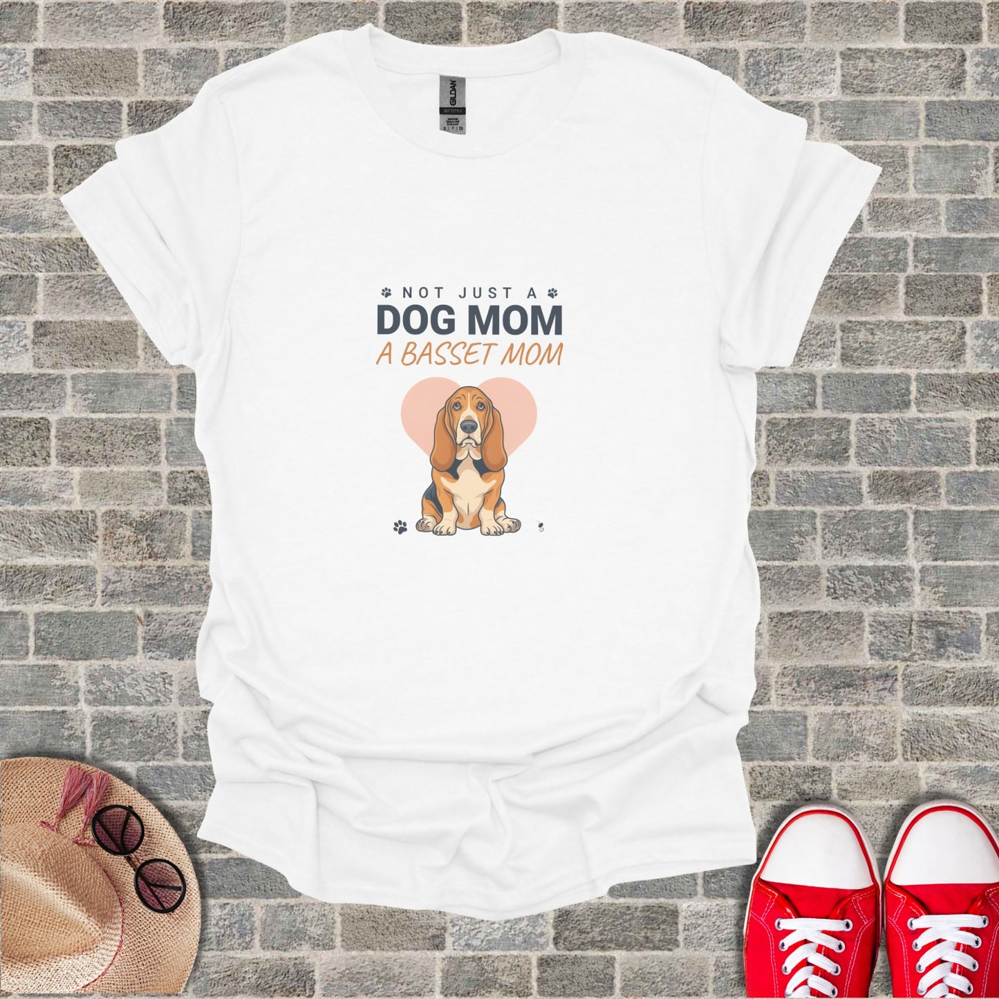 White t-shirt with a Basset Hound graphic and the text "NOT JUST A DOG MOM A BASSET MOM"
