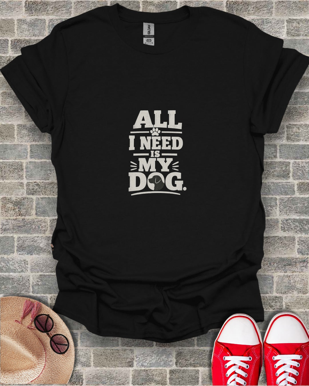 Black t-shirt with "All I Need Is My Dog" text and dog paw graphic.