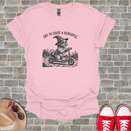 Dog wearing witch hat riding a scooter, "OFF TO CAUSE A KERFUFFLE."