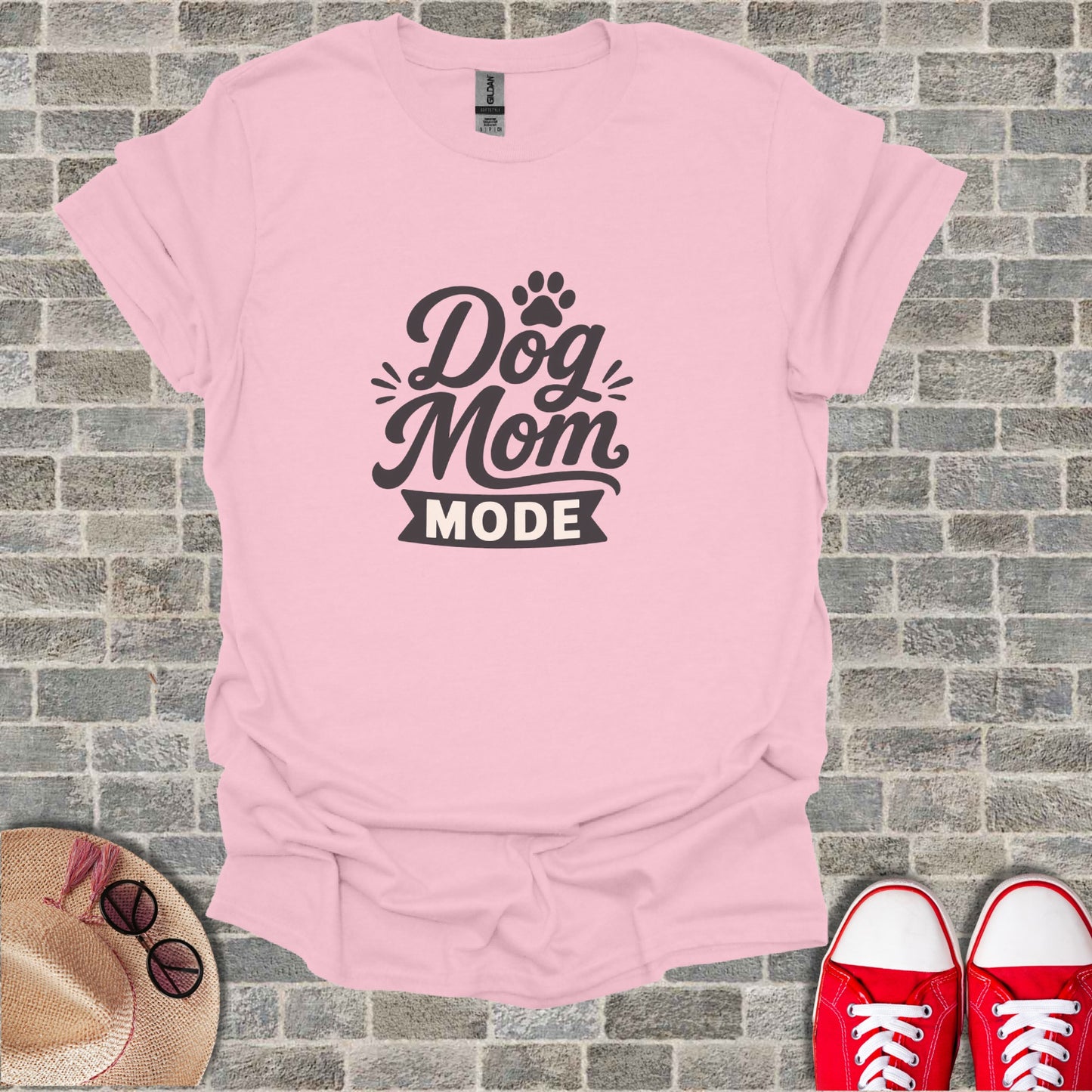 Pink t-shirt with "Dog Mom Mode" text and paw print graphic.