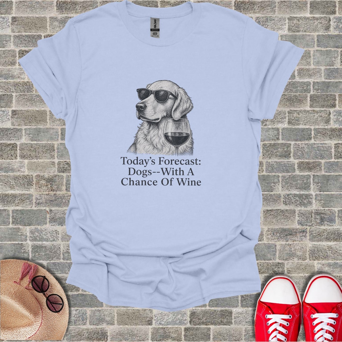 Light blue t-shirt with a drawing of a dog wearing sunglasses and holding a wine glass. Text reads "Today's Forecast: Dogs--With A Chance Of Wine".
