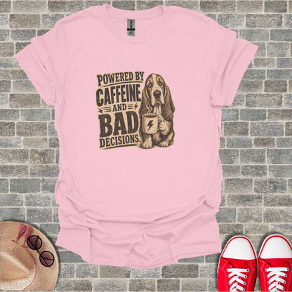 Basset hound holding coffee mug with text "Powered by Caffeine and Bad Decisions".