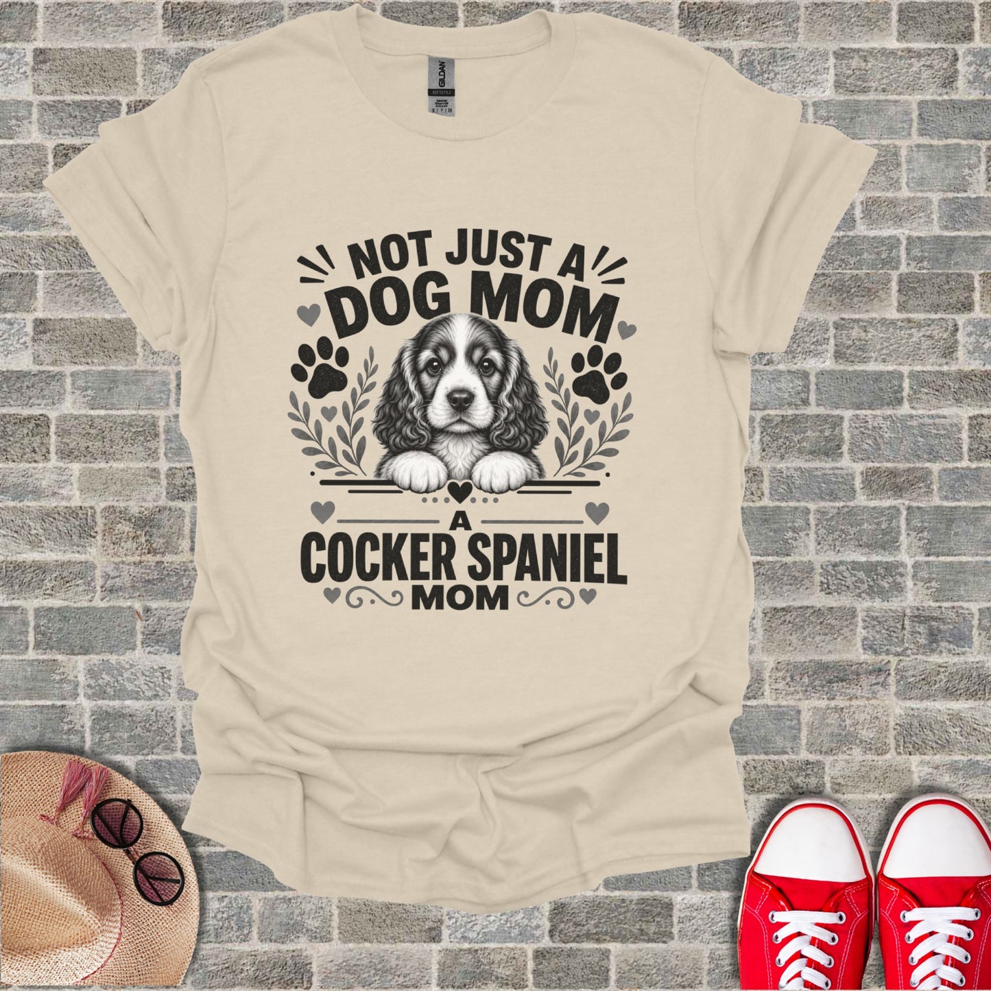 T-shirt with "Not Just a Dog Mom. A Cocker Spaniel Mom" text and dog graphic.