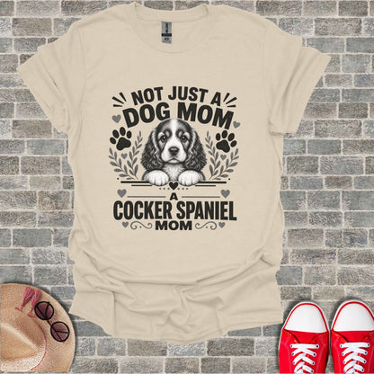 T-shirt with "Not Just a Dog Mom. A Cocker Spaniel Mom" text and dog graphic.