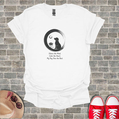 White t-shirt with a black dog silhouette in a circle, lotus flower, and inspirational text.