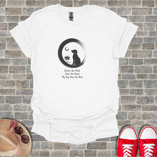 White t-shirt with a black dog silhouette in a circle, lotus flower, and inspirational text.