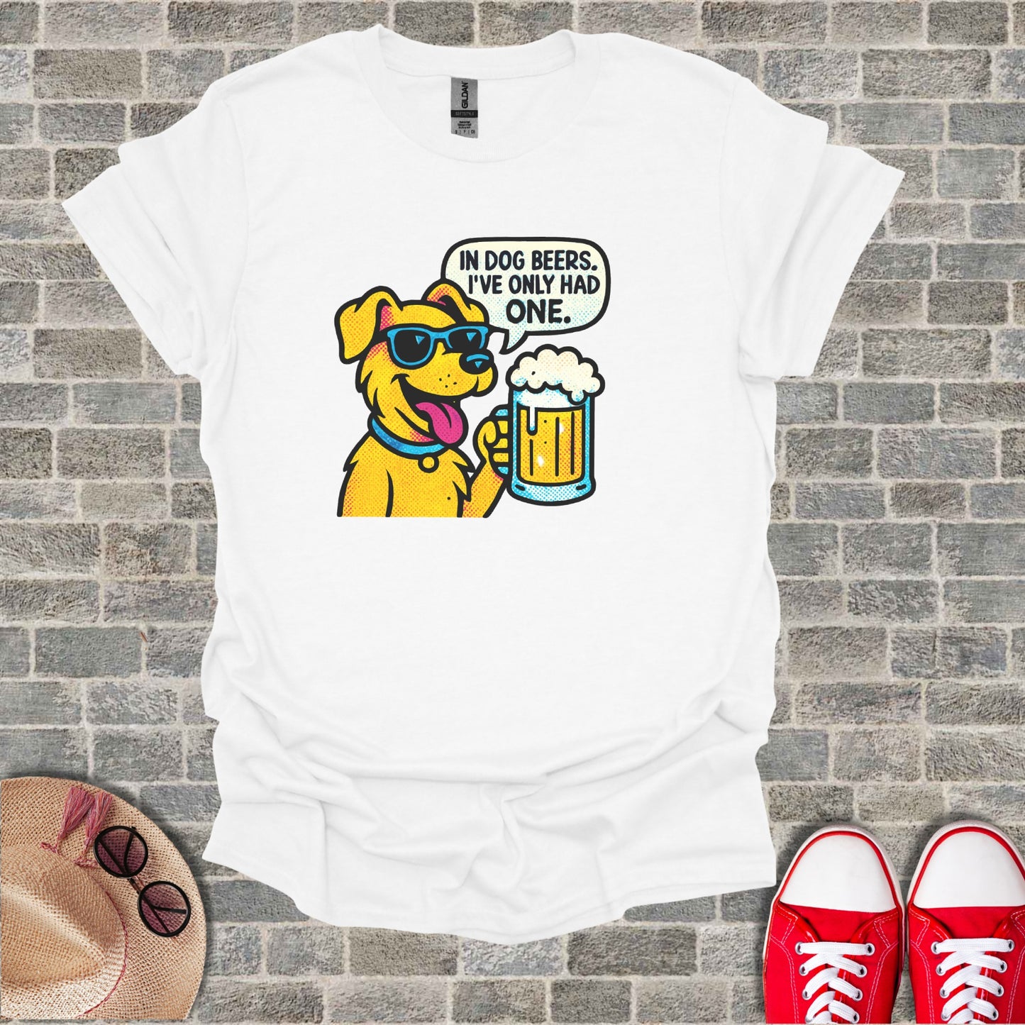 Dog wearing sunglasses holding a beer, text reads "IN DOG BEERS, I'VE ONLY HAD ONE."