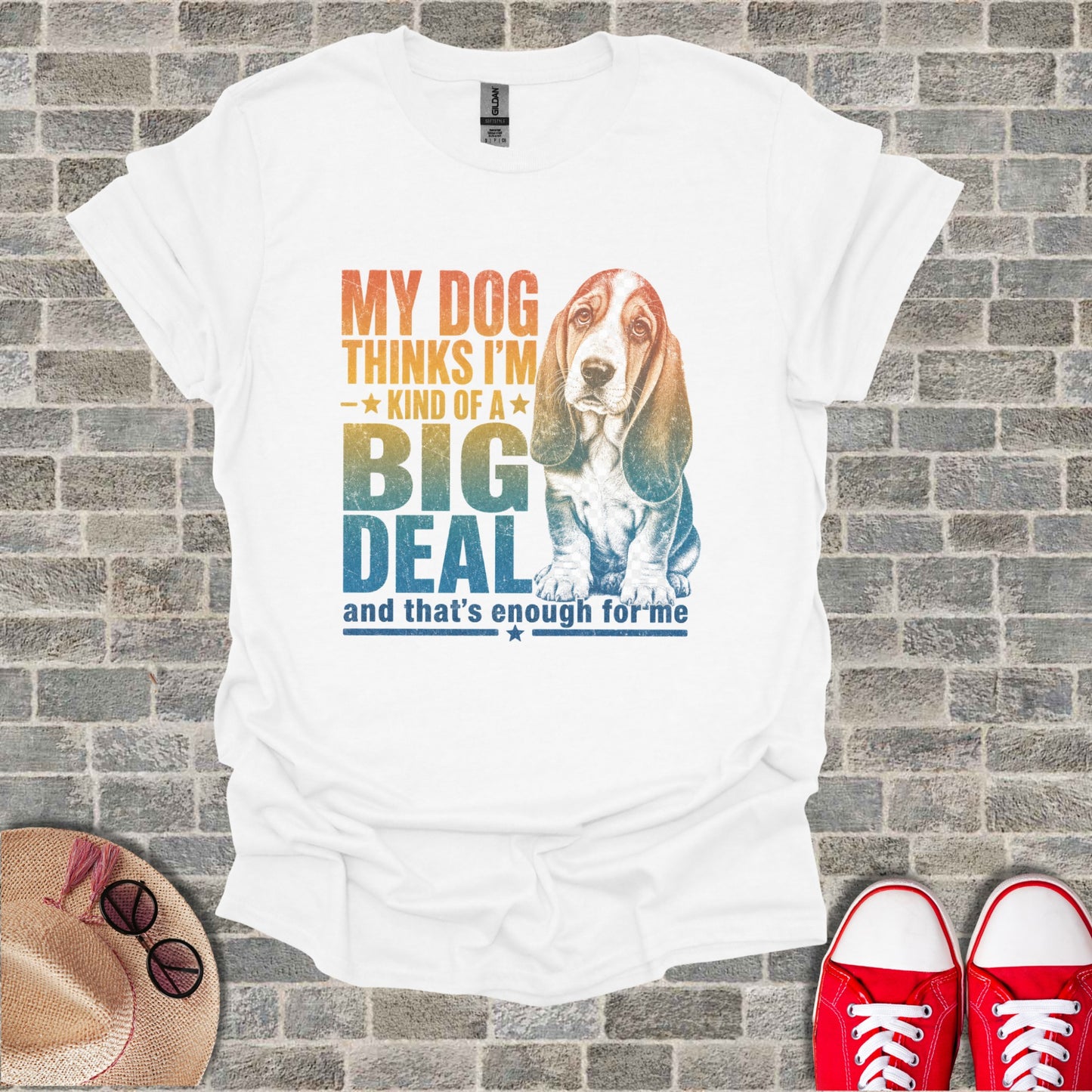 White t-shirt with a distressed graphic of a Basset Hound and the text "My Dog Thinks I'm Kind of a Big Deal."