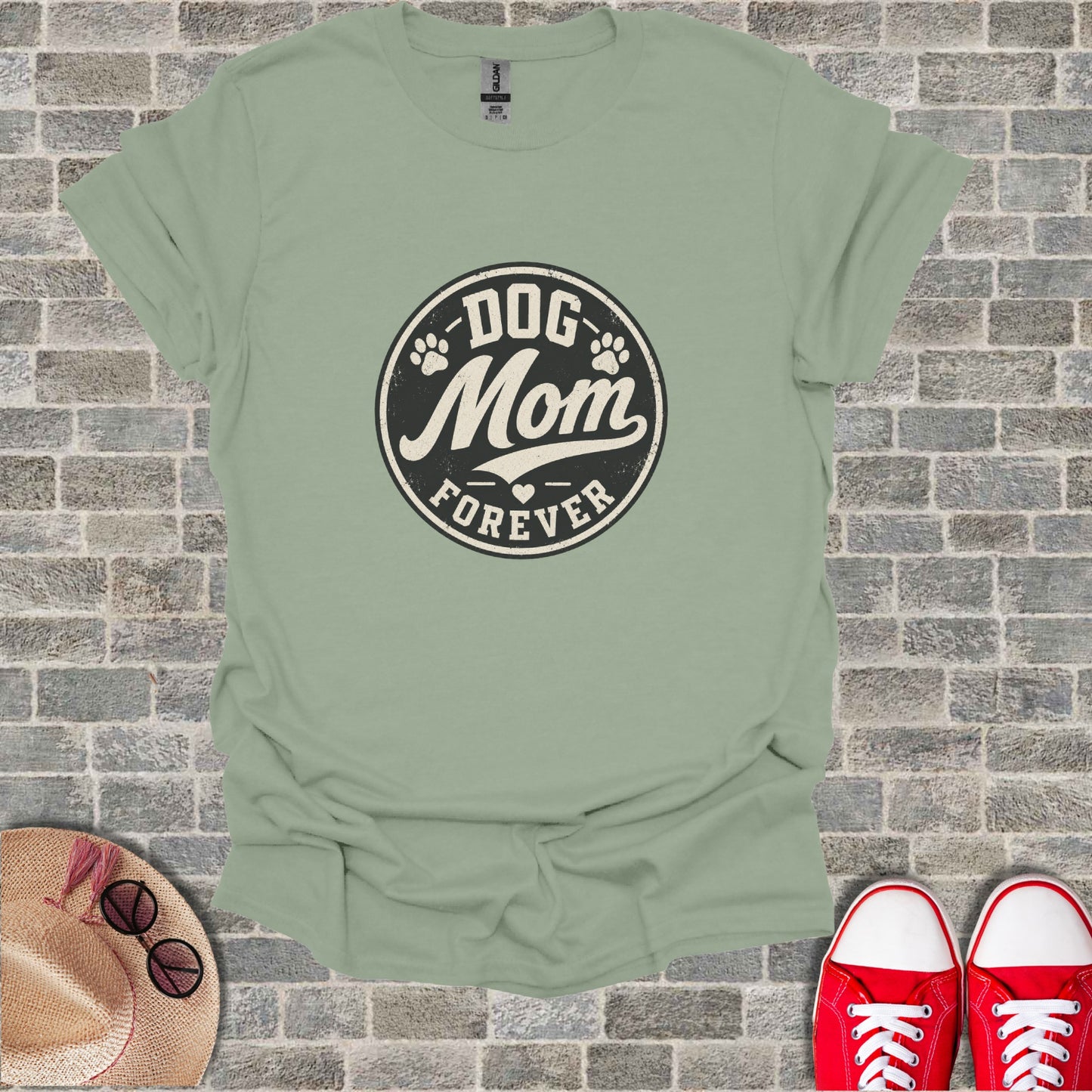 Green t-shirt with "Dog Mom Forever" text and paw print design.