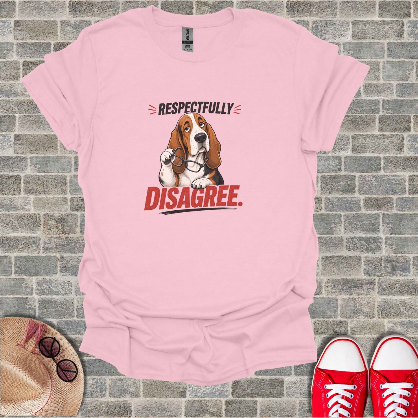 Pink t-shirt with a Basset Hound wearing glasses and text "Respectfully Disagree."