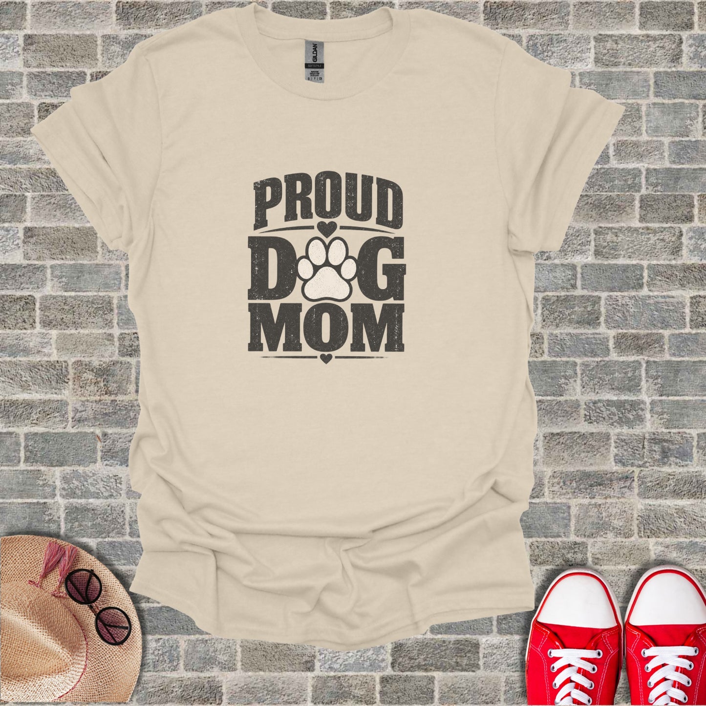Cream t-shirt with distressed "Proud Dog Mom" text and paw print graphic.