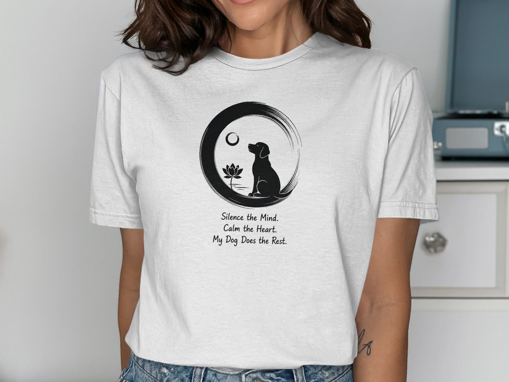 T-shirt with Zen circle, lotus, dog silhouette, and inspirational text.