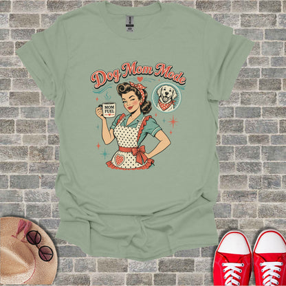 T-shirt with "Dog Mom Mode" text, retro woman, and dog graphic.