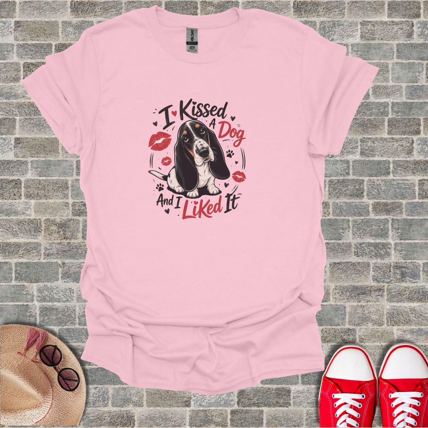 Pink t-shirt with a Basset Hound and "I Kissed a Dog and I Liked It" text.