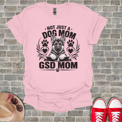Pink t-shirt with "Not Just a Dog Mom ...A GSD Mom" text and German Shepherd puppy graphic.