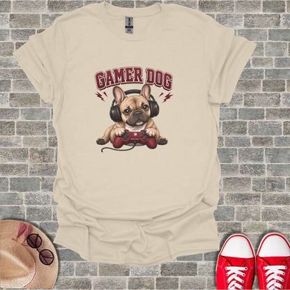 French bulldog wearing headphones and holding a video game controller.