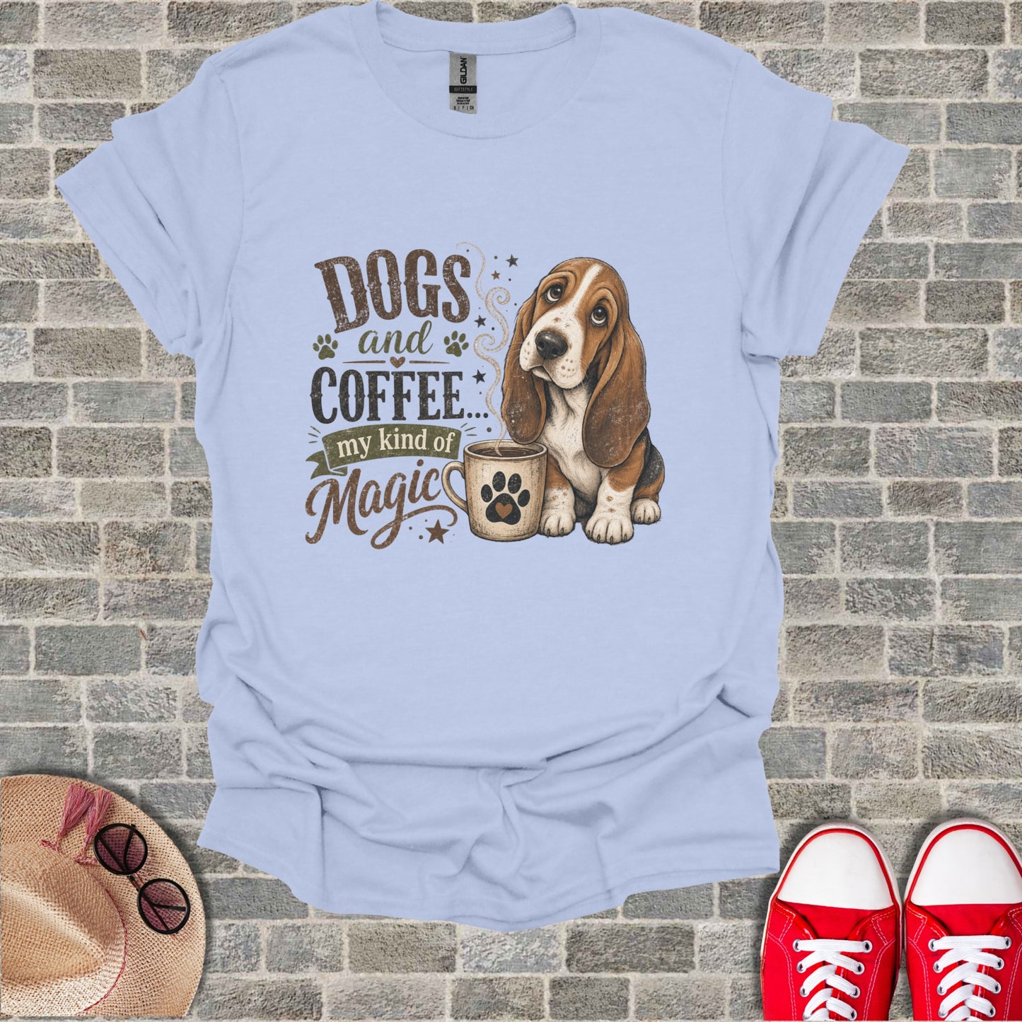 Light blue t-shirt featuring a basset hound with coffee and text "Dogs and Coffee... my kind of Magic."