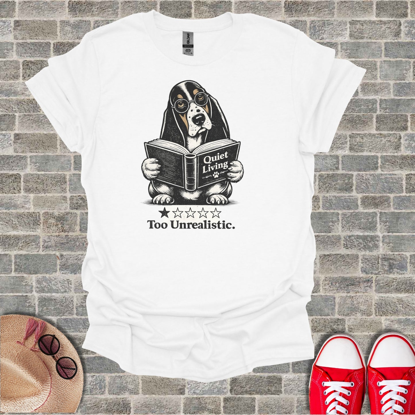 White t-shirt with a Basset Hound wearing glasses reading a book.