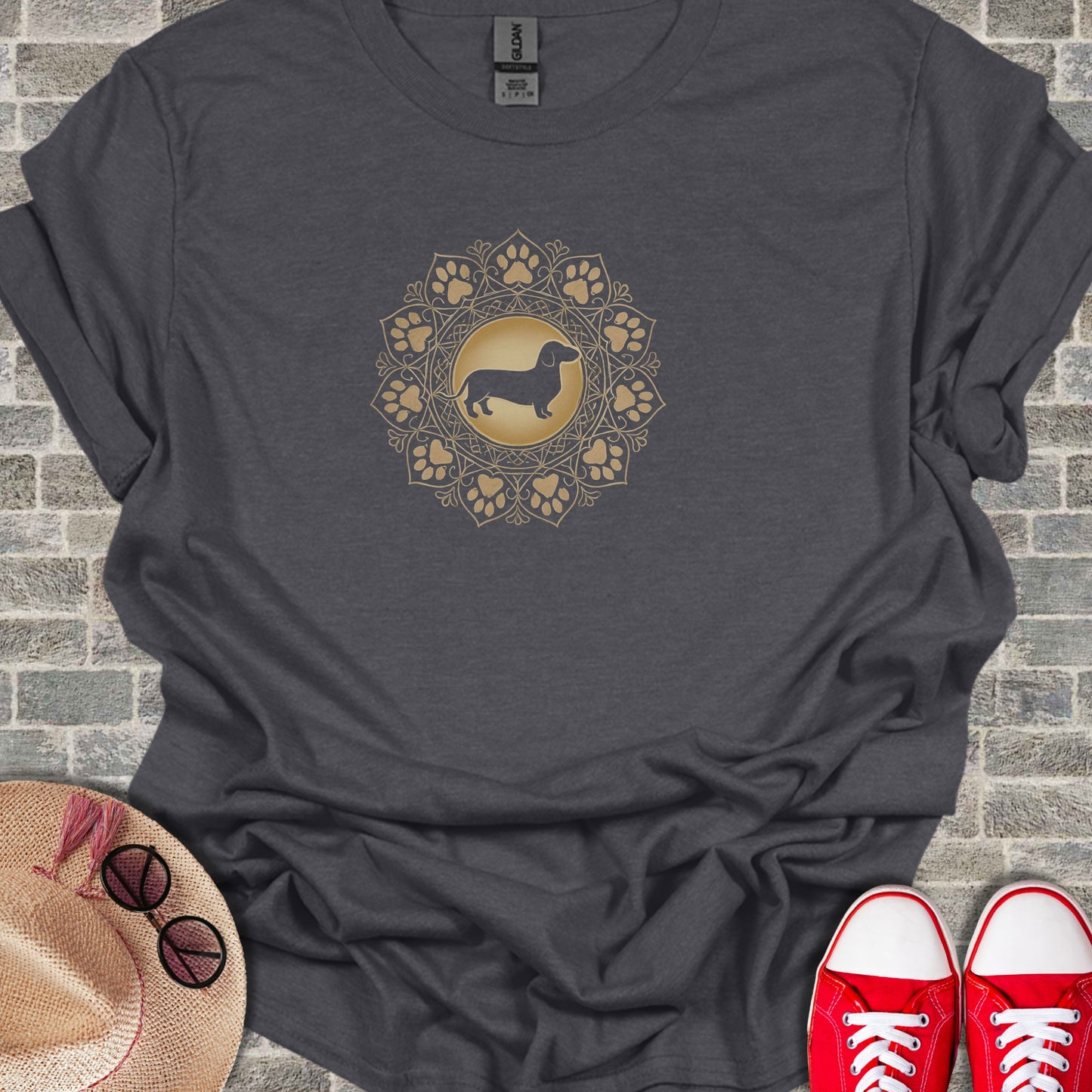 Dark t-shirt with a golden dachshund mandala design.