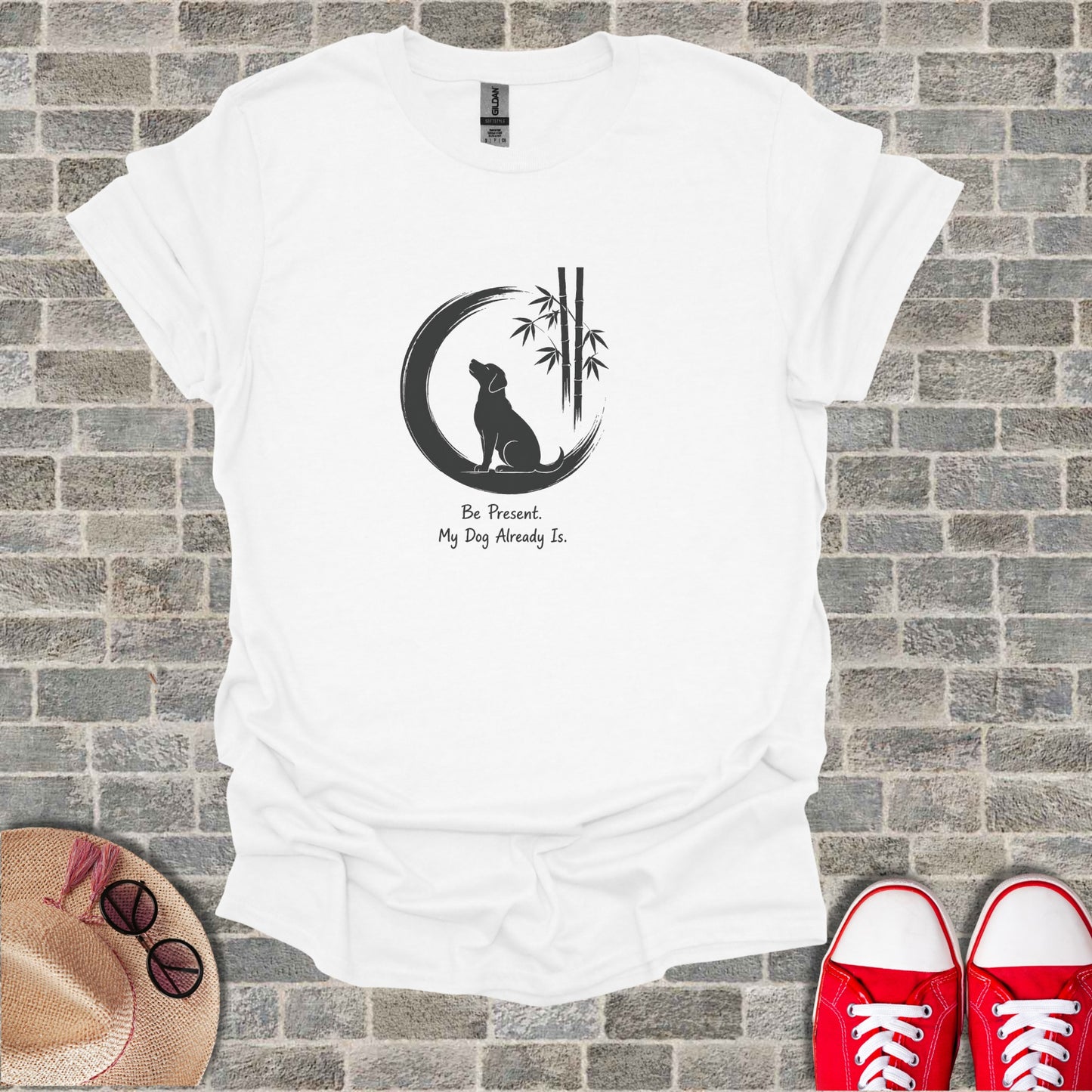 White t-shirt with a dog, moon, bamboo, and text "Be Present. My Dog Already Is."