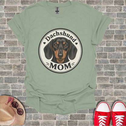 Dachshund Mom graphic on a light green t-shirt
