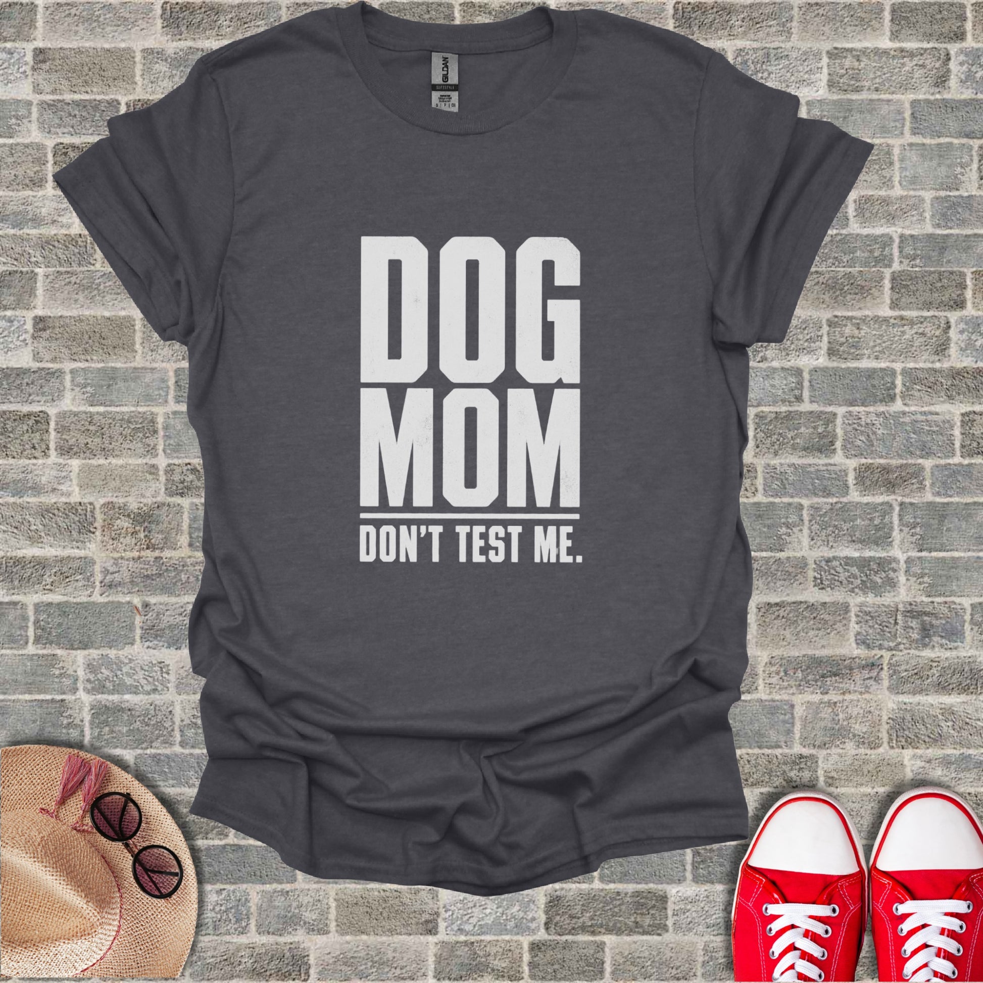 Dark gray t-shirt with white text reading "DOG MOM DON'T TEST ME."