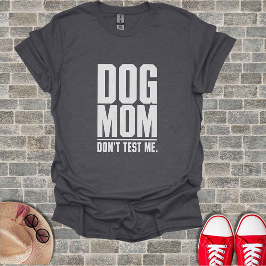 Dark gray t-shirt with white text reading "DOG MOM DON'T TEST ME."