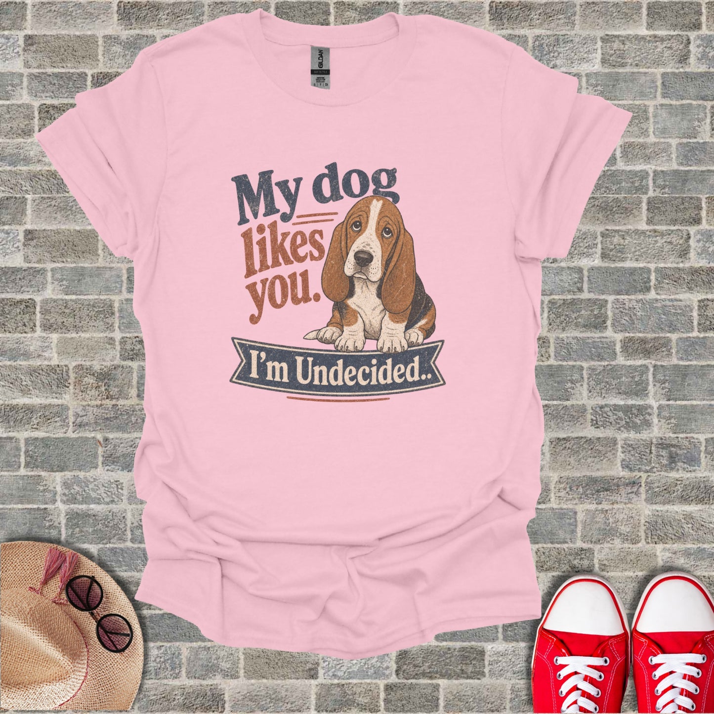 Pink t-shirt with a Basset Hound and text "My dog likes you. I'm Undecided."