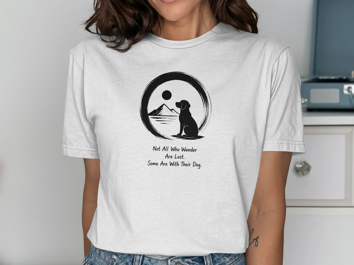 Black graphic of a dog and mountains with text "Not All Who Wander Are Lost. Some Are With Their Dog."