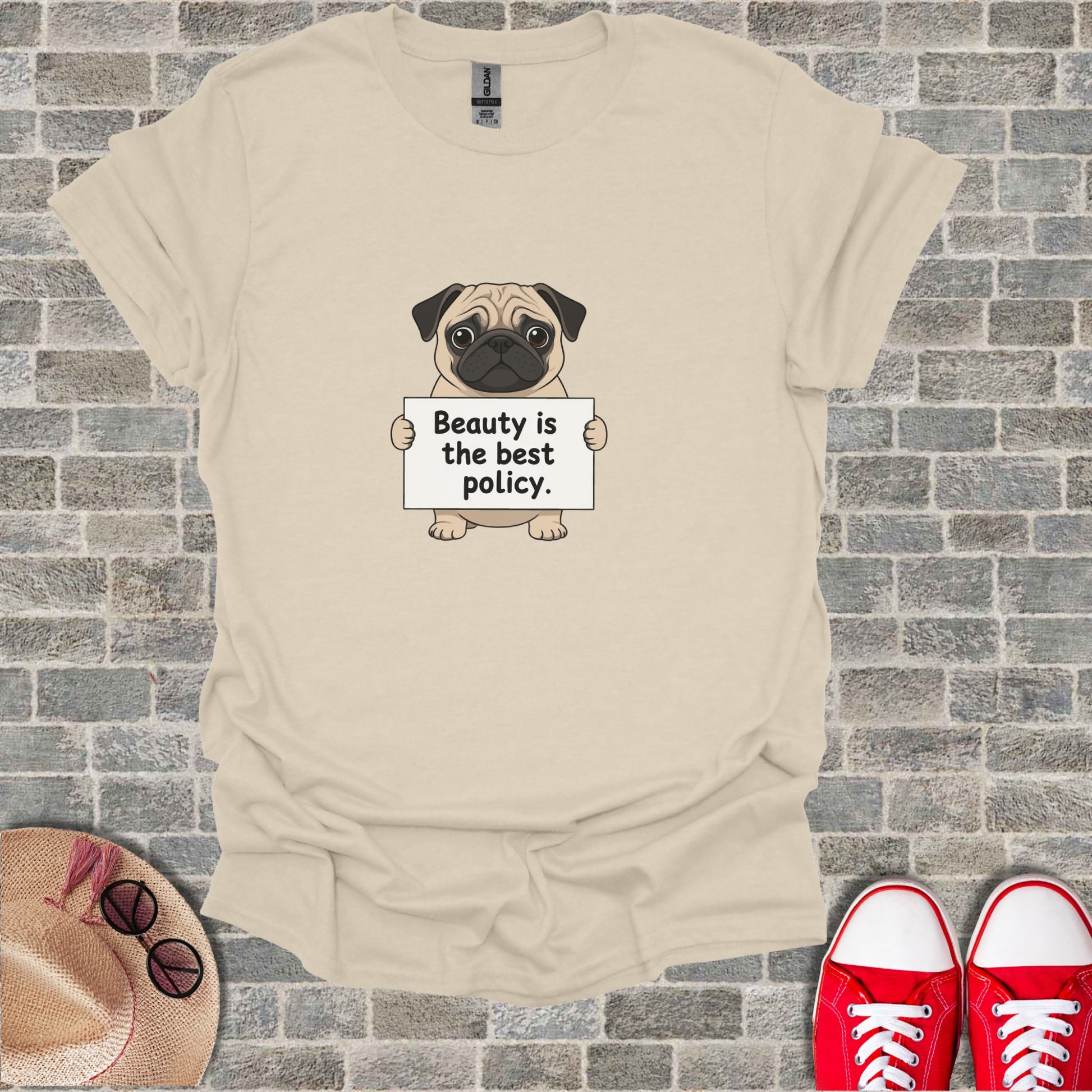 Pug holding a sign that says "Beauty is the best policy."