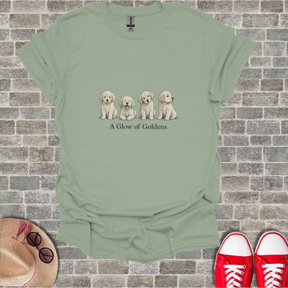 Four golden retriever puppies sit in a line under text that reads "A Glow of Goldens."
