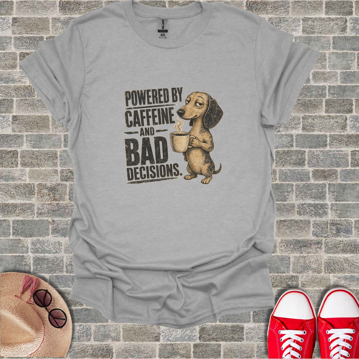 Dachshund holding coffee mug with text "POWERED BY CAFFEINE AND BAD DECISIONS."