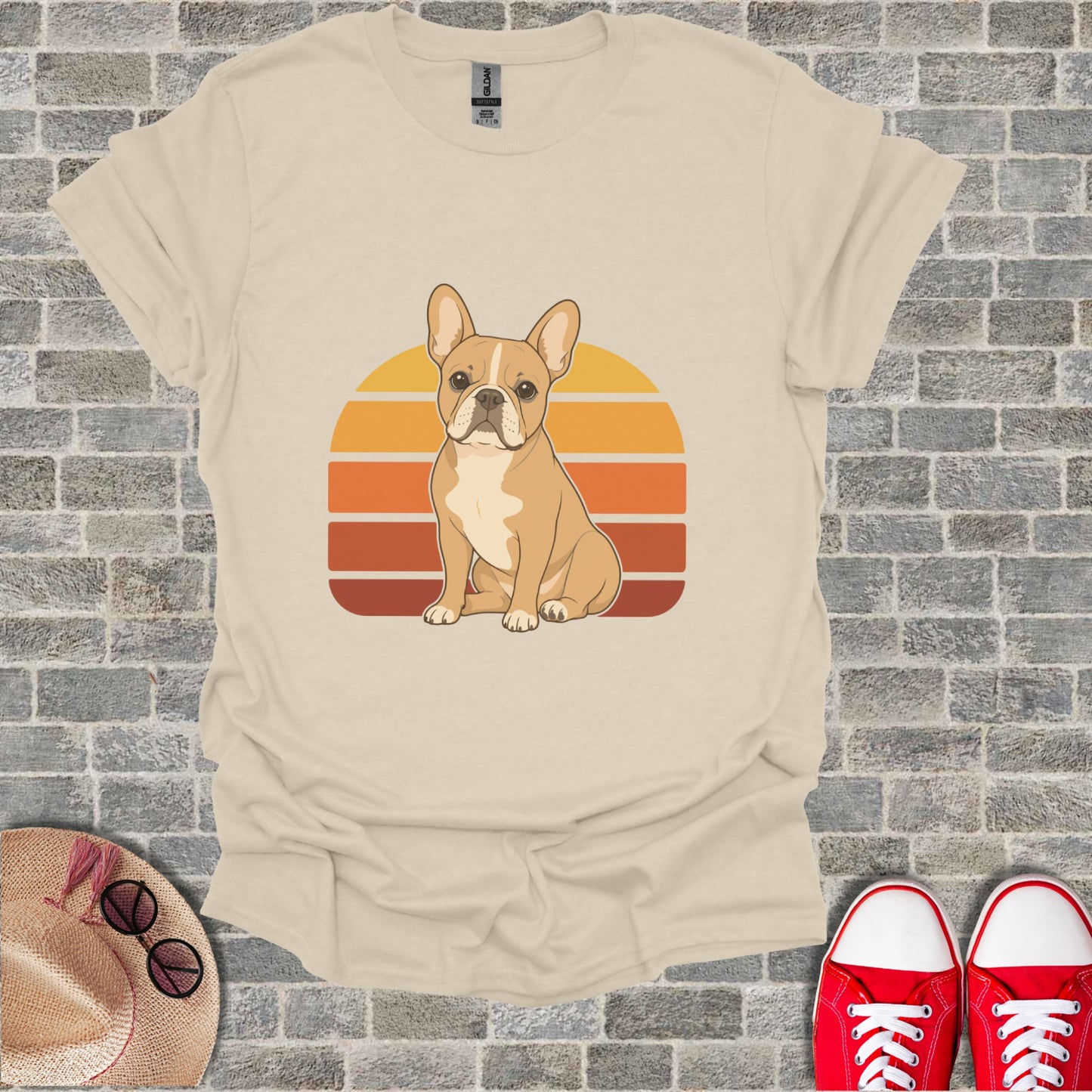 T-shirt with a tan French bulldog sitting in front of a retro sunset graphic.