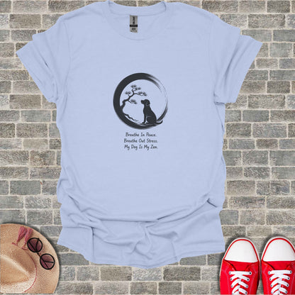 Light blue t-shirt with dog silhouette, tree, and Zen quote.