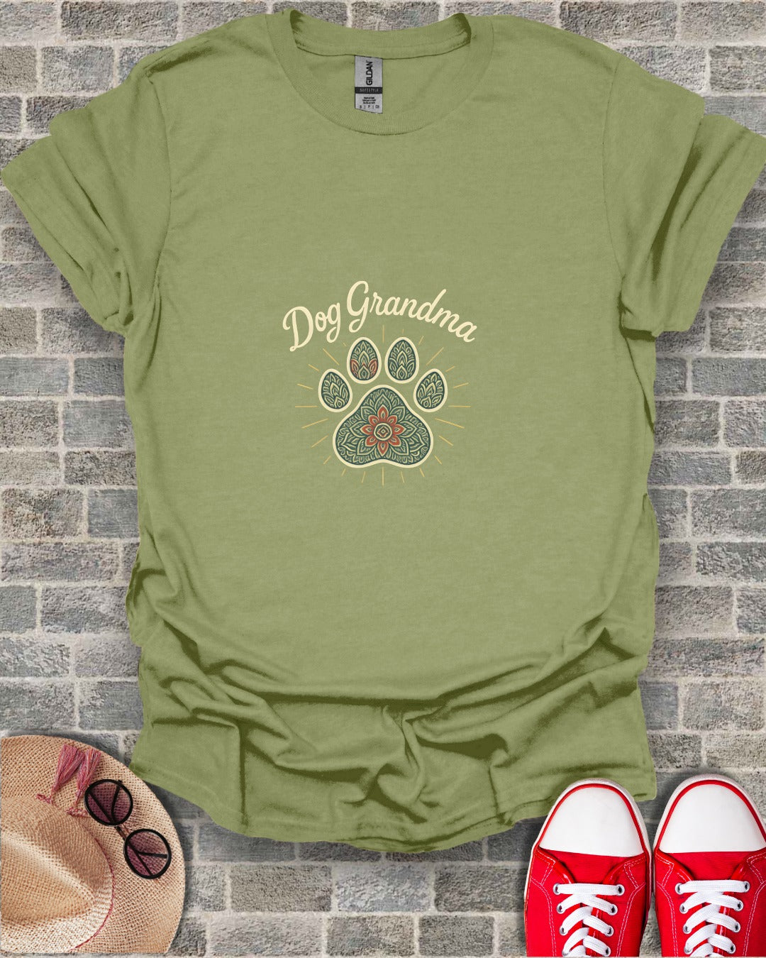 Olive green t-shirt with "Dog Grandma" text and paw print design.