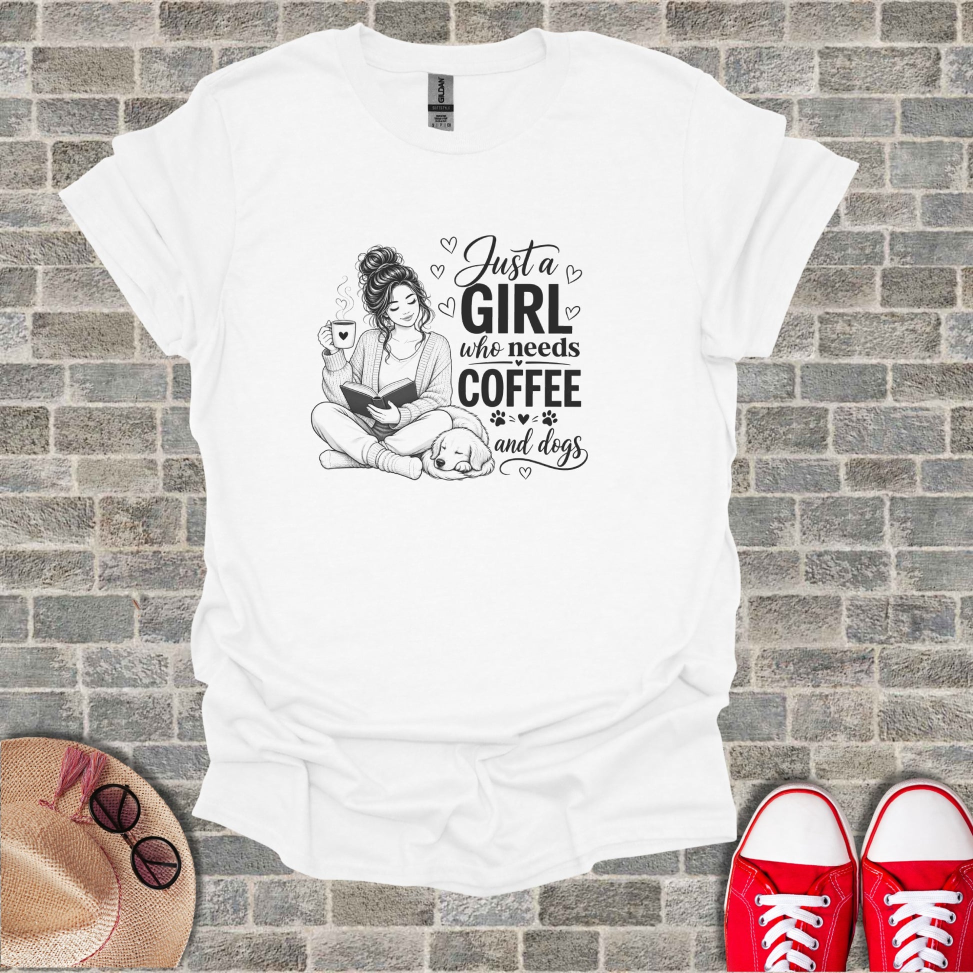 White t-shirt with "Just a girl who needs coffee and dogs" text and dog illustration.
