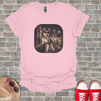 Pink t-shirt with a husky wearing sunglasses drinking a beverage.