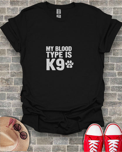 Black t-shirt with white text "MY BLOOD TYPE IS K9" and paw print.