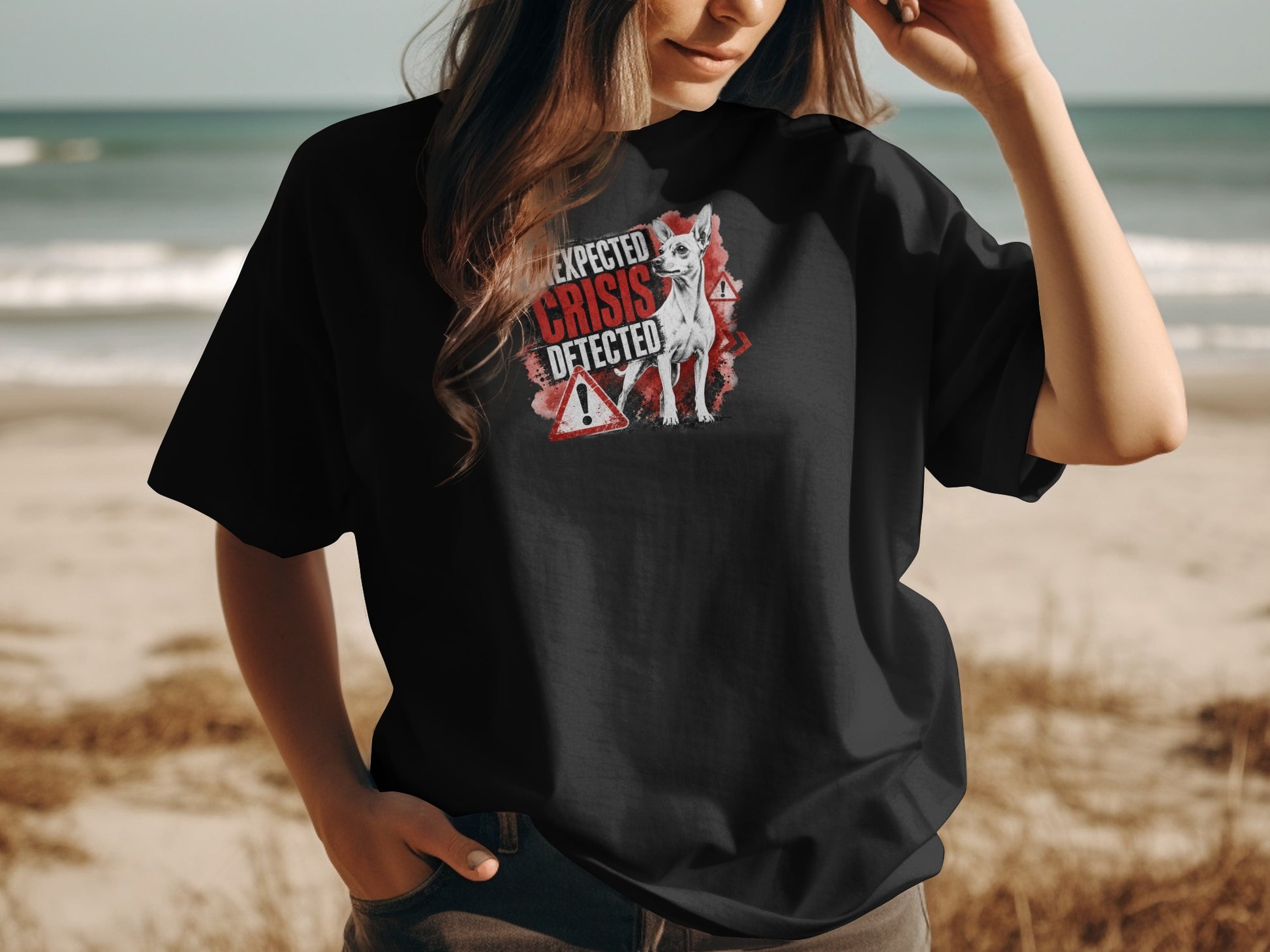 Black t-shirt with chihuahua wearing safety glasses, "EXPECTED CRISIS DETECTED" text.