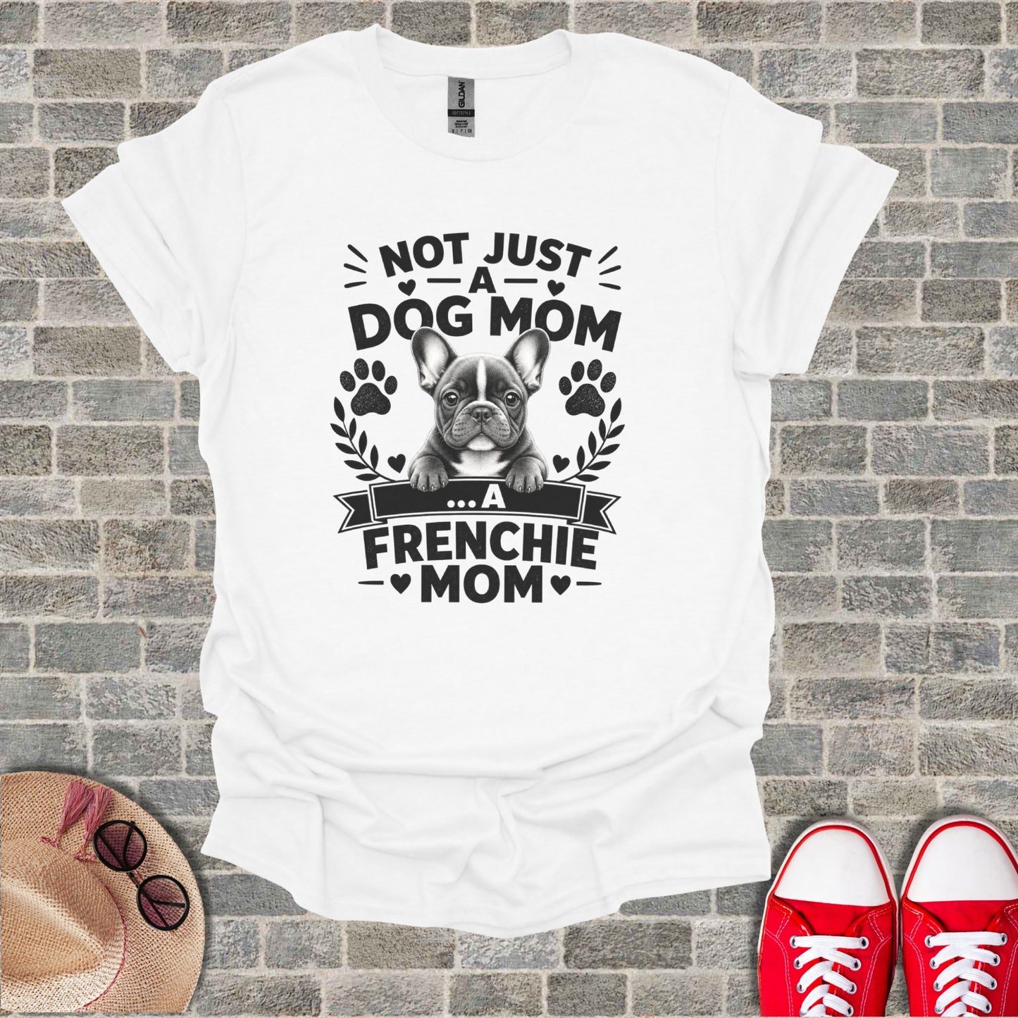White t-shirt with French bulldog graphic and "Not Just A Dog Mom... A Frenchie Mom" text.