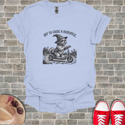 Dog in witch hat rides scooter, "Off to Cause a Kerfuffle" text.