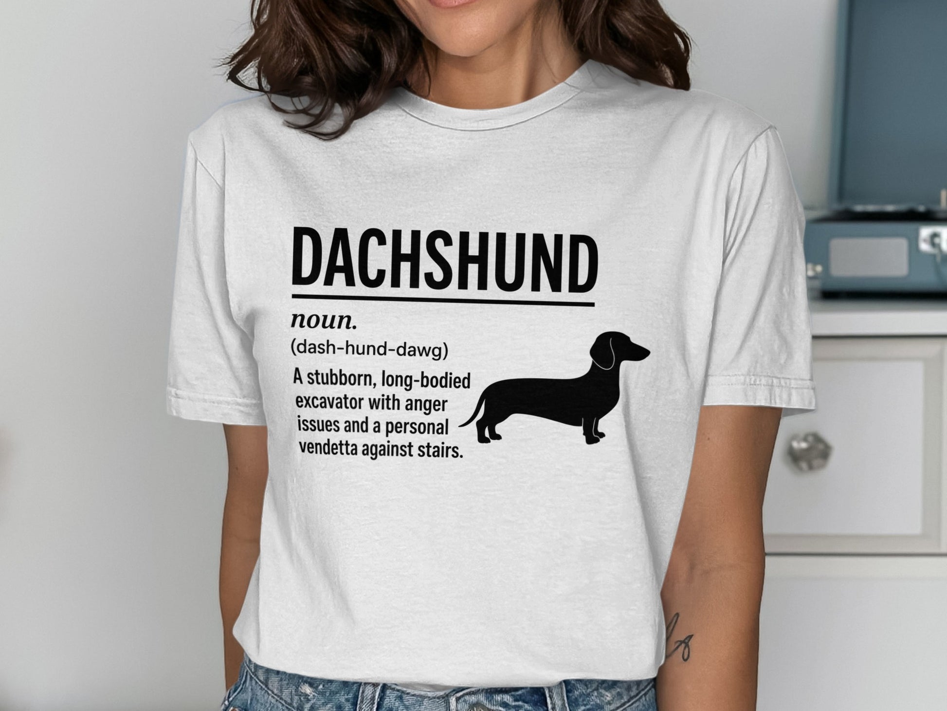 Dachshund definition t-shirt with black dog silhouette and text.
