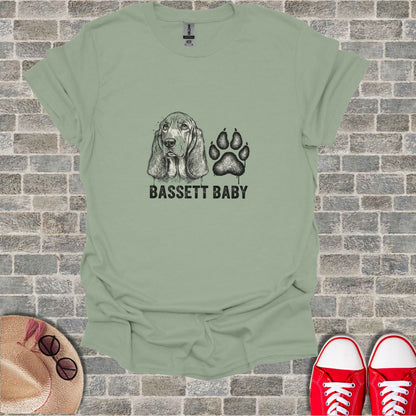 Light sage t-shirt with "BASSETT BABY" and paw print graphic.