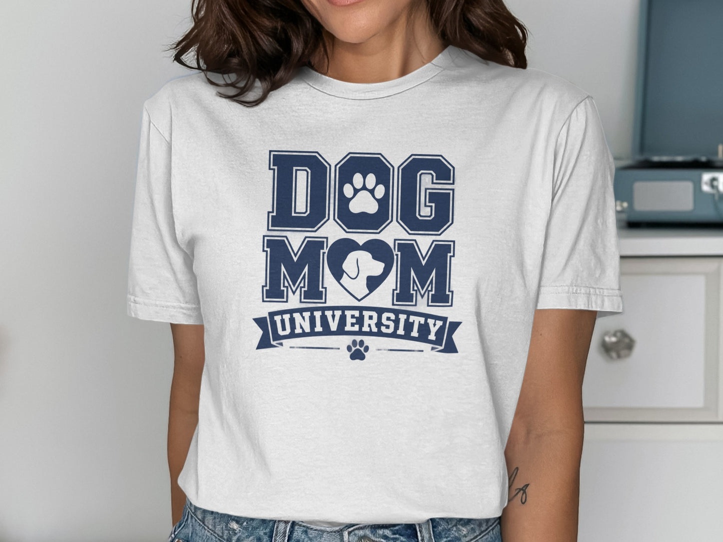 White t-shirt with "Dog Mom University" text and paw print logo.