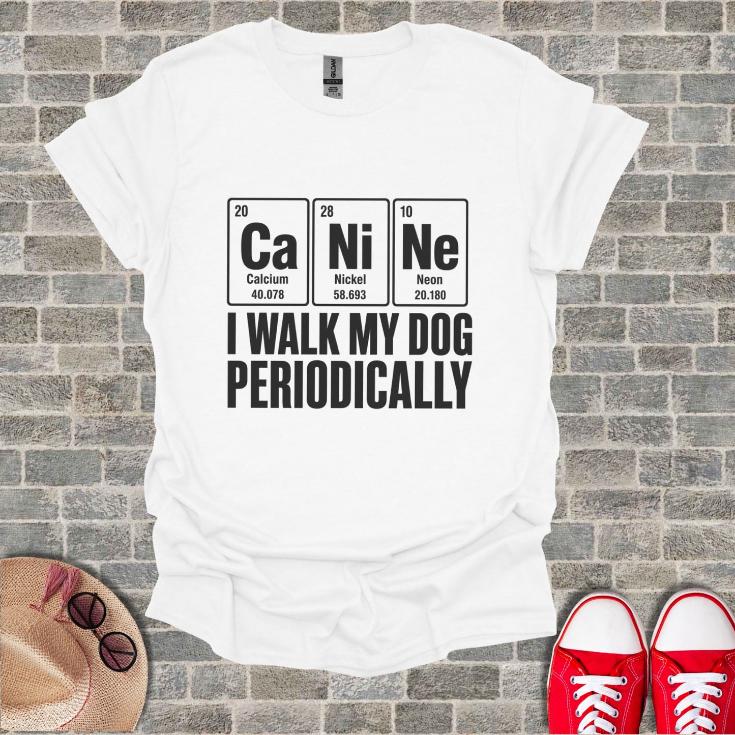 White t-shirt with periodic table elements forming "CaNiNe" and text "I WALK MY DOG PERIODICALLY".