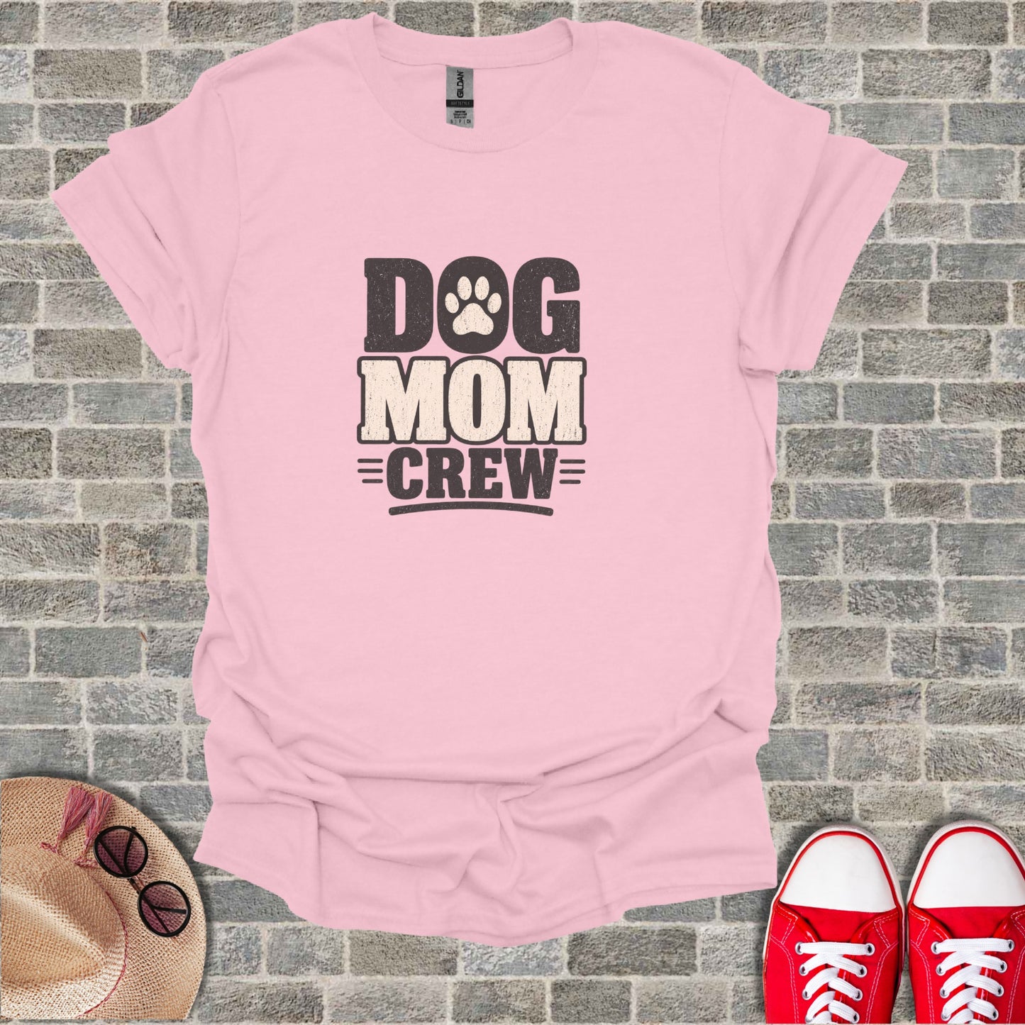 Pink t-shirt with "Dog Mom Crew" text and paw print.