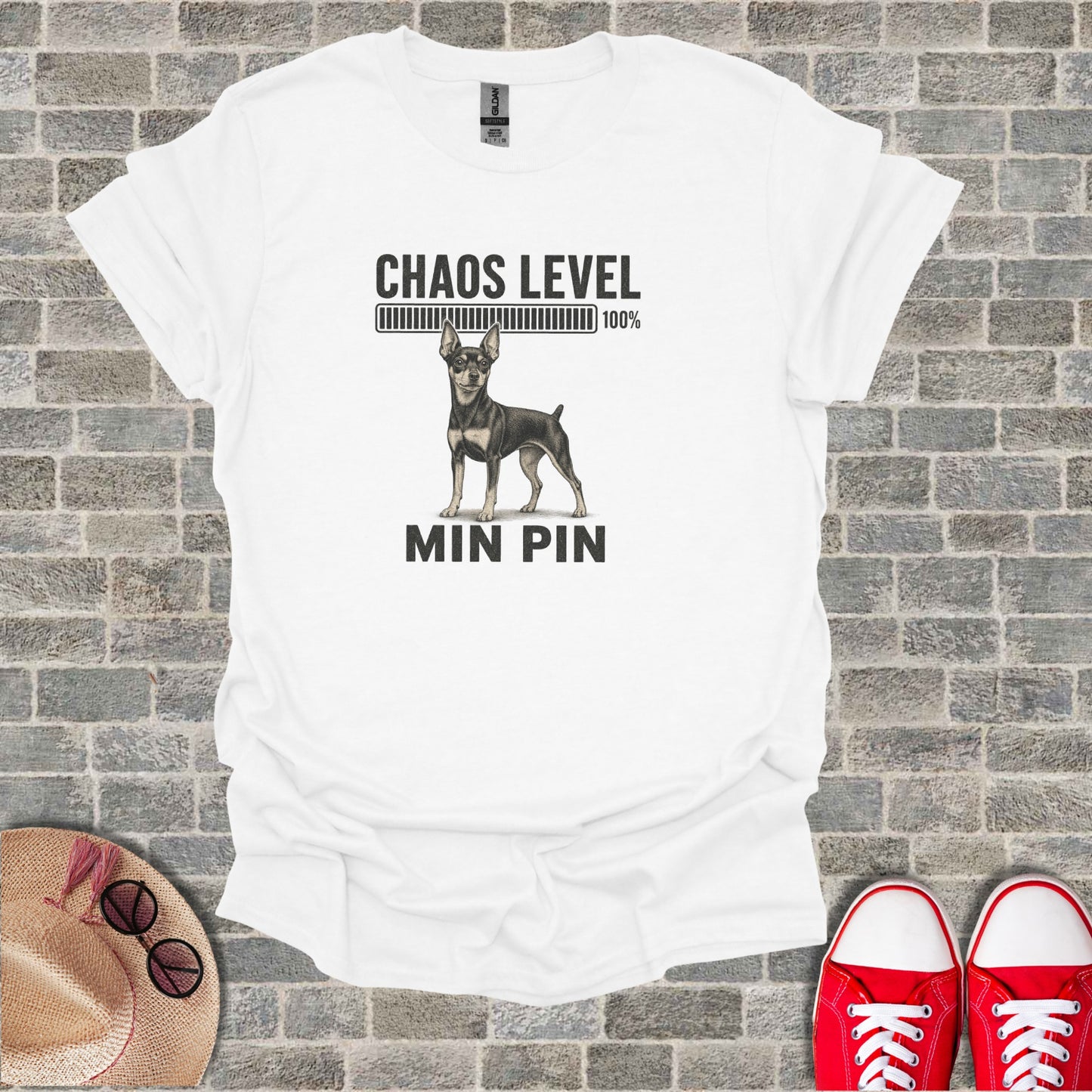 White t-shirt with "Chaos Level 100%" and "MIN PIN" featuring a mini pinscher dog.